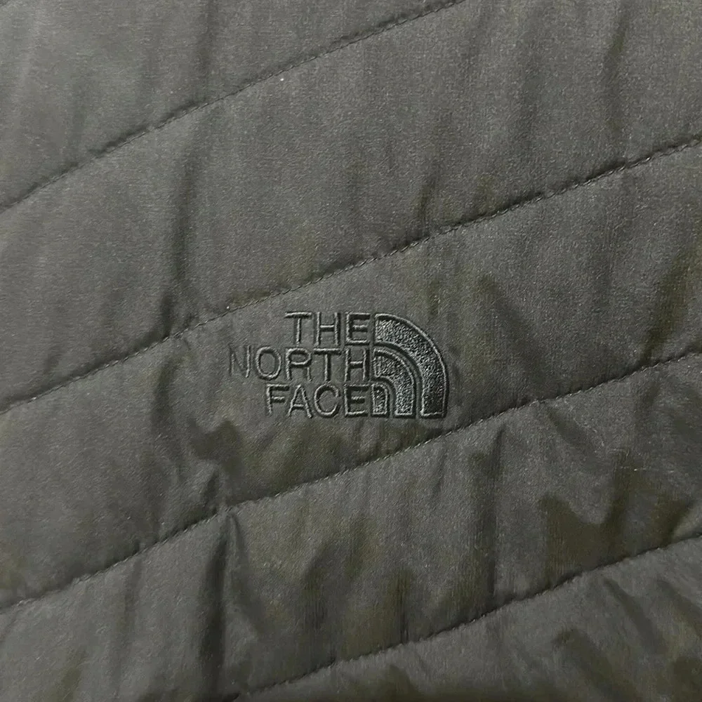 The North Face black puffer vest full front zip, pockets, front and back logo